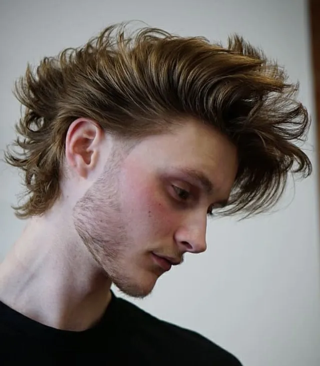 15 Broflow Hairstyle Ideas: The Perfect Blend of Rugged and Refined 9 10 fauxhawk messy mid length hairstyle for men