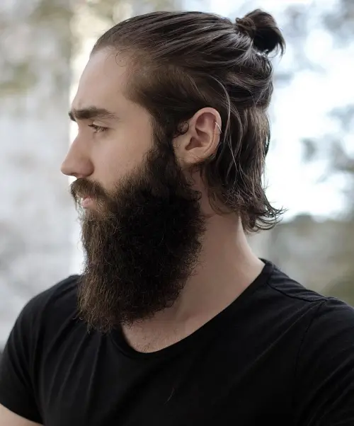 16 Stylish Haircuts for Men with Beards: A Modern Grooming Guide 12 25 medium semi bun and long beard