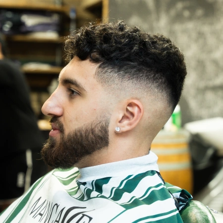 14 Fresh Haircut Ideas for Men with Curly Hair: Elevate Your Look with Texture and Style 10 64b0cf7cab1f5a87c10f6e79 mid fade haircut 1