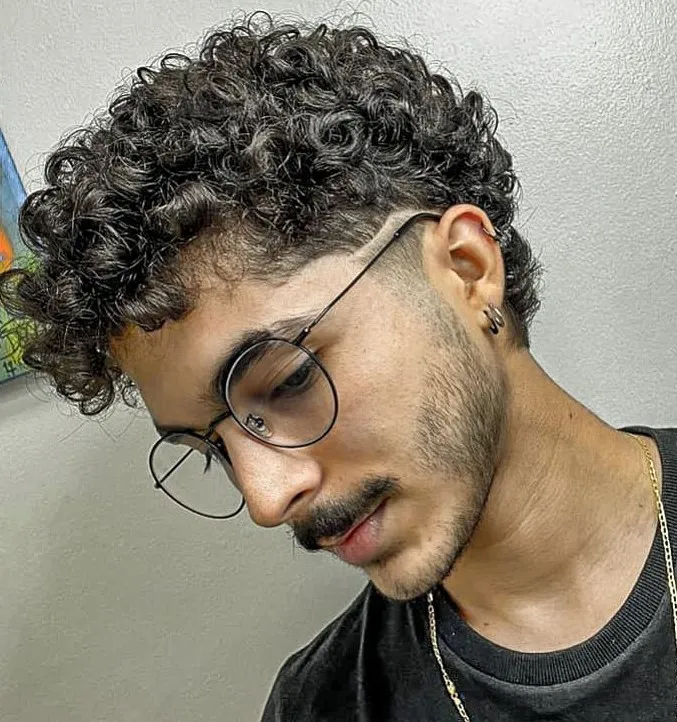 15 Natural Curly Styles: Embrace Texture with Confidence and Elegance 7 9 defined faded curls with curly fringe mens hairstyle