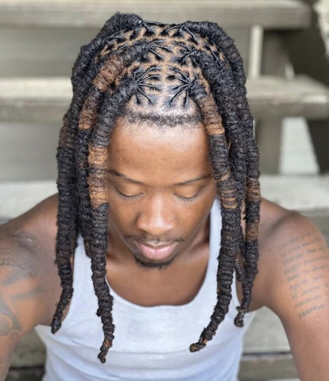 11 Creative Dread Styles for Black Men: A Bold Expression of Culture and Style 8 Cosmic Spiral Barrel Roll Locs 650x753 1