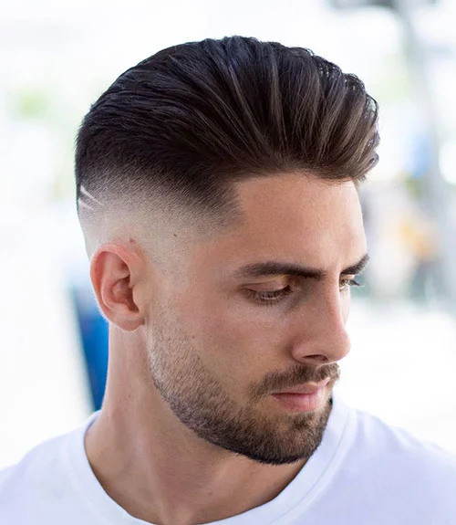 16 Stylish Haircuts for Men with Beards: A Modern Grooming Guide 11 High Volume Brush Back with Mid Skin Fade and Beard