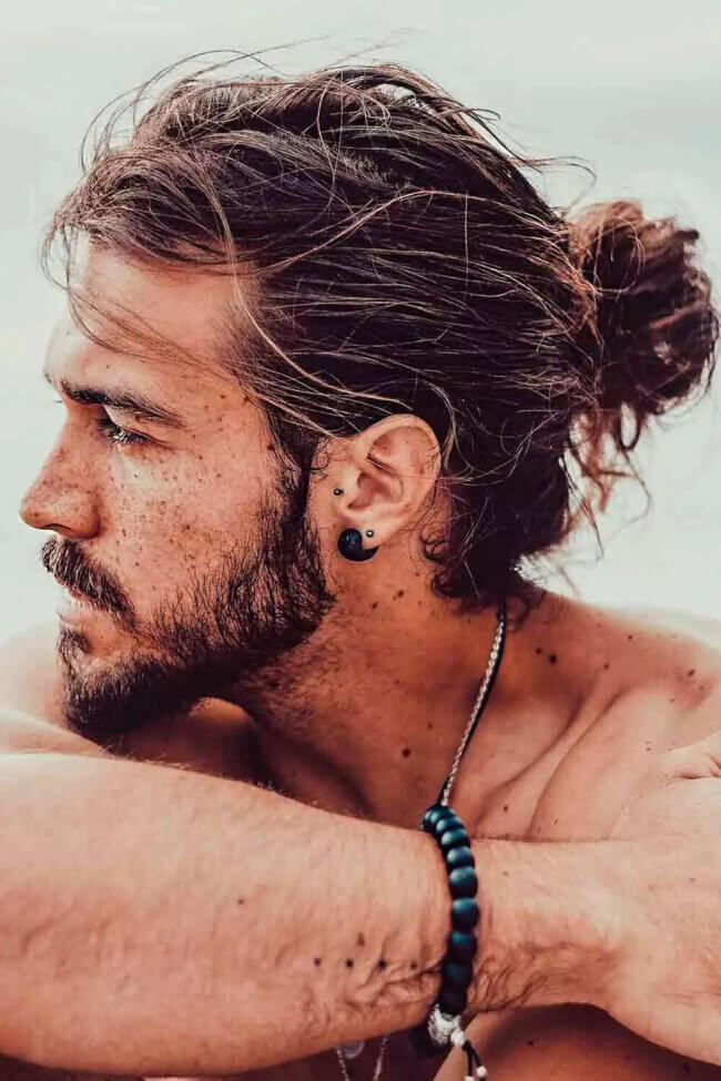 14 Trendy Long Haircuts for Men: Elevate Your Look with Style and Substance 12 Messy Bun Long Hairstyle 650x975 1