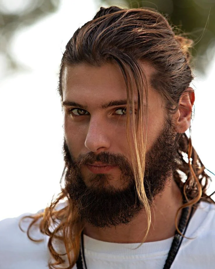 14 Trendy Long Haircuts for Men: Elevate Your Look with Style and Substance 7 The curly half up half down