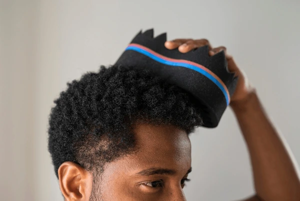 14 Iconic Afro Inspired Cuts: A Celebration of Heritage and Style 5 close young handsome african man 600nw 2332231321