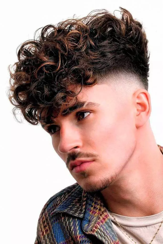 15 Bold Highlight Ideas for Men: Stand Out with Statement Hair Colour 8 hair highlights for men caramel short curly fade 683x1024 1