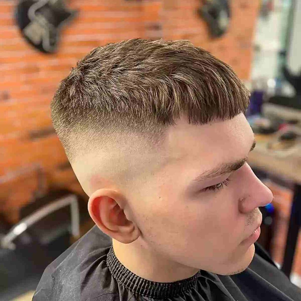 18 Modern Punk Hairstyles: Edgy Looks with a Contemporary Twist 8 high bald fade with textured micro bangs on men