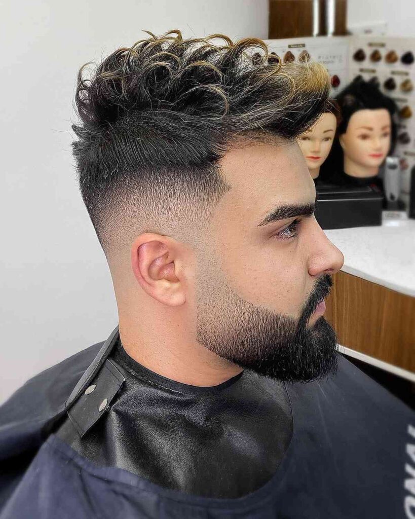 16 Stylish Haircuts for Men with Beards: A Modern Grooming Guide 17 messy top with highlights and a beard fade