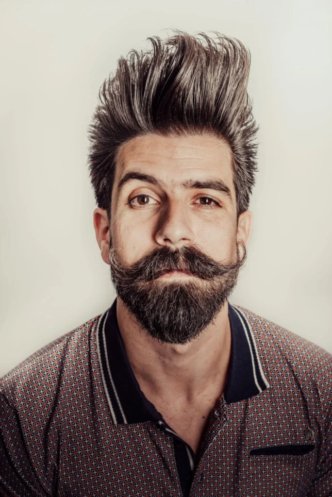 16 Stylish Haircuts for Men with Beards: A Modern Grooming Guide 4 pompadour hairstyle cff7e785 56b8 4ca8 baea bd0362889b8e