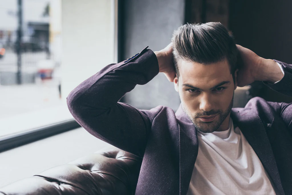 11 Modern Undone Pompadour Ideas: Effortless Volume with a Contemporary Twist 4 portrait man smoothing