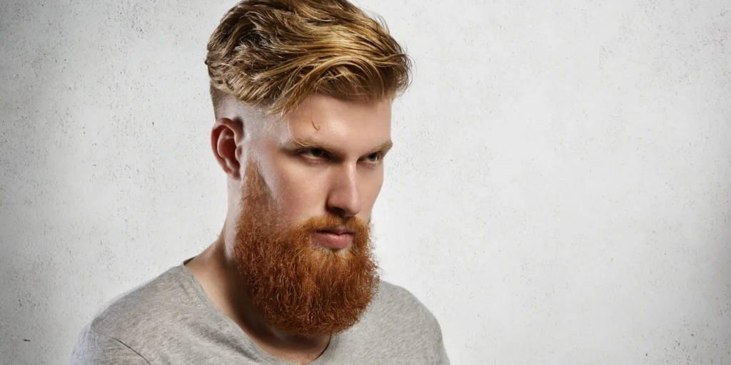 16 Stylish Haircuts for Men with Beards: A Modern Grooming Guide 7 slick back undercut 2 1