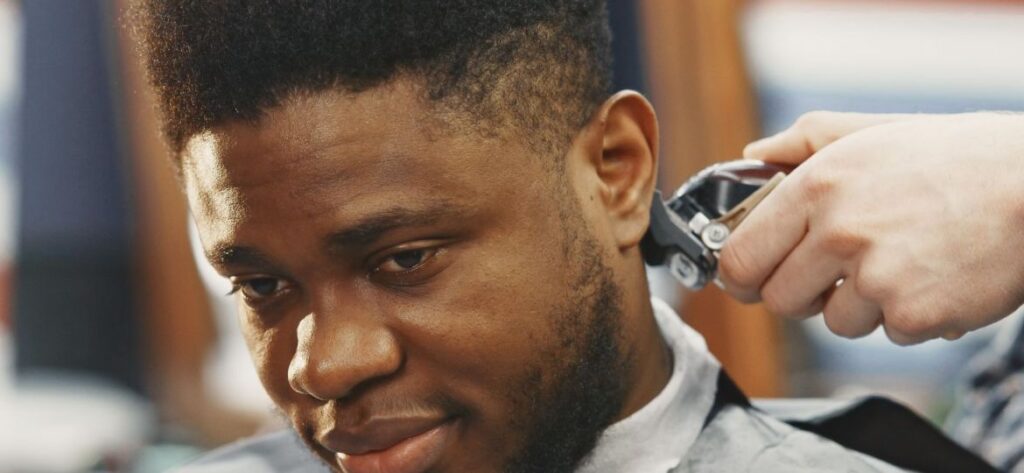 21 Ultra Short Haircuts: Refined, Practical, and Bold Styles for Every Man 5 young african american man visiting barbershop scaled thegem gallery fullwidth