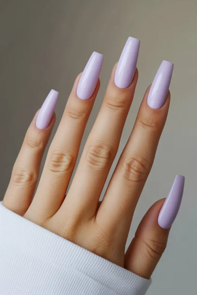 18 Stunning Coffin Nail Designs to Elevate Your Style Game 13 long coffin nails painted in soft lavend Fr5xmoiISk2IETP3vkRS5g 7quqGjSnRAilfEEqB9XpAg