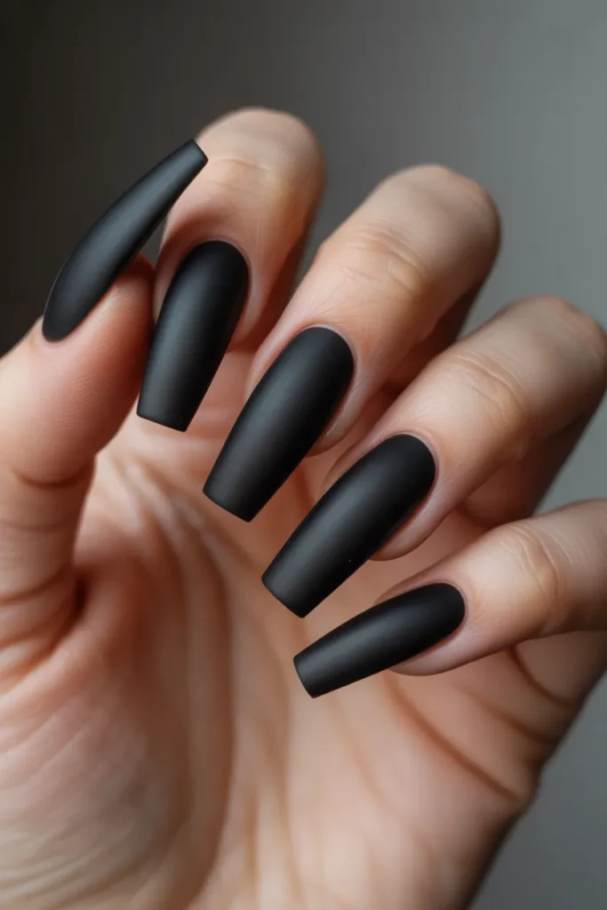18 Stunning Coffin Nail Designs to Elevate Your Style Game 4 matte black coffin shaped nails with a s tbDVl 80RUeWudo7rvCWow hIQsA3v7QgC4nPMdprfebQ