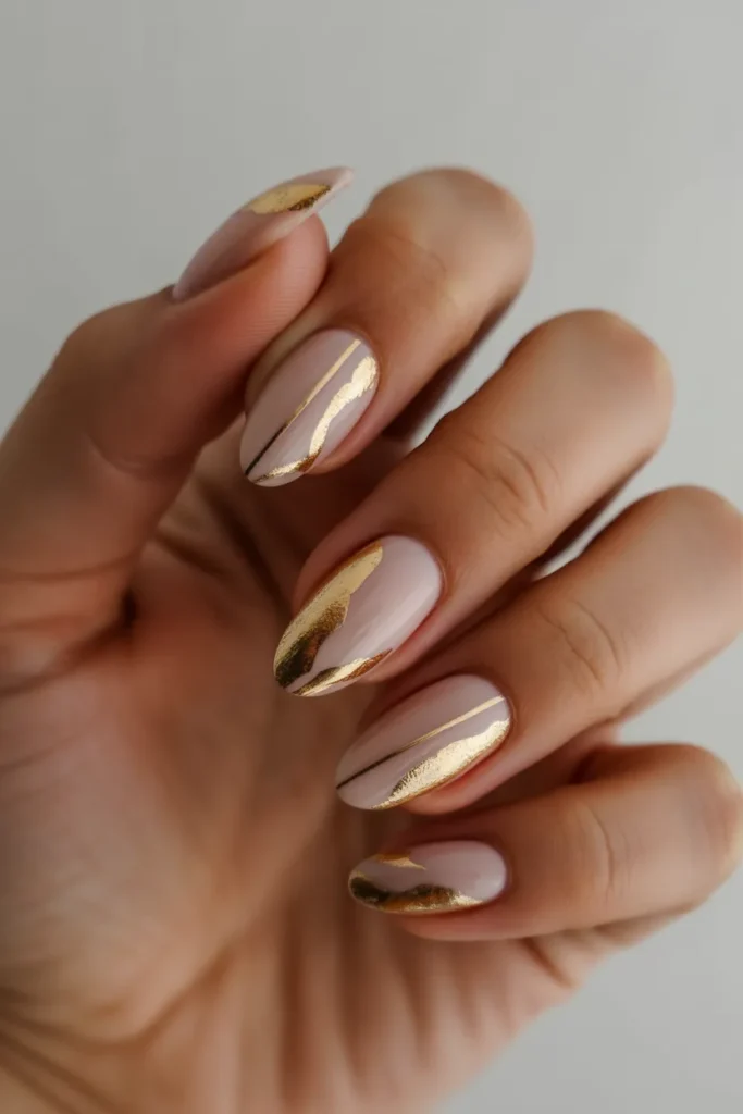 nude almond nails decorated with gold fo 6W0QuF8ISPSFWTyj1n5rYQ wr6TwYHXS5C5VpQhsOwUhg