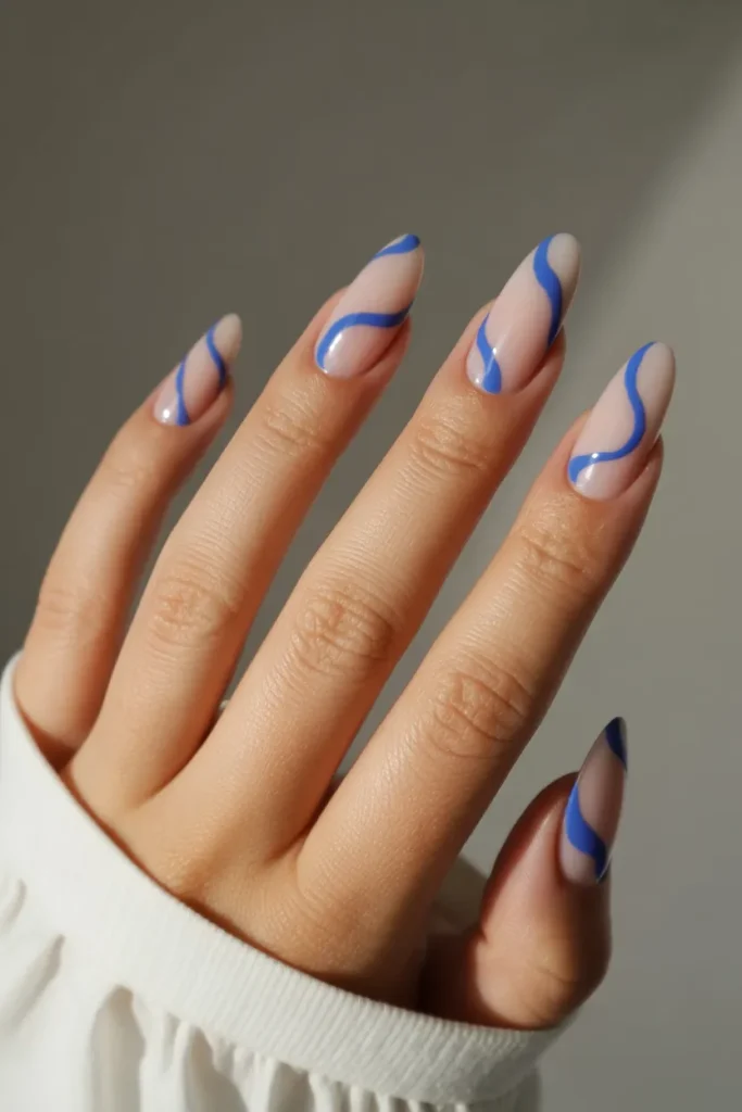 nude base nails with abstract blue swirl 0xx45gi5QUOKqv69komHDg Ub5nbbm7SqmaEAkzCv7kvg