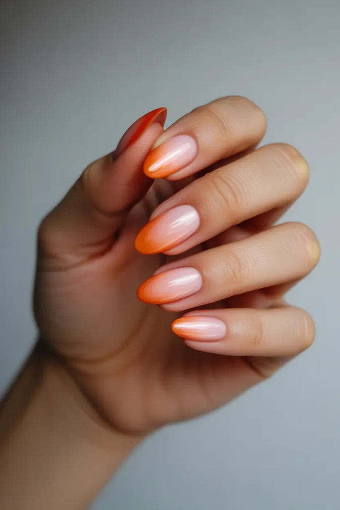 ombre almond nails blending pink to oran XbhTWFS3S9ycN1f8FEInag K8HB8MDiQBOPJwOd6AngtA